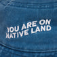 'YOU ARE ON NATIVE LAND' BUCKET HAT